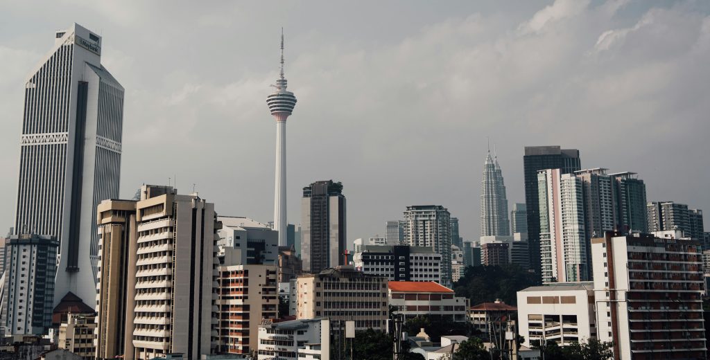 Explore the dynamic Kuala Lumpur skyline showcasing iconic buildings like the KL Tower and Petronas Towers.