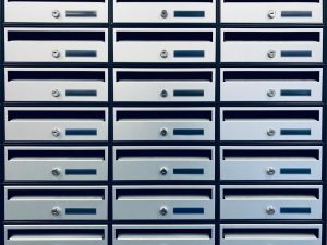 Array of silver mailboxes arranged in rectangular patterns, Geel, Belgium.